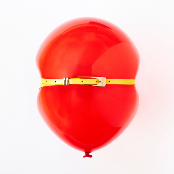 Bloating red balloon that is full