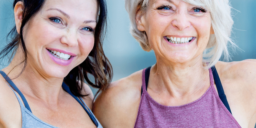 midlife metabolism two women over 45 celebrating fitness