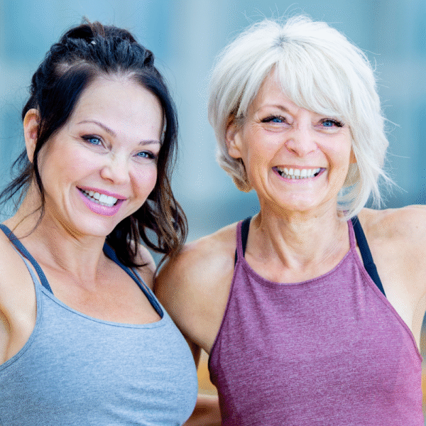 midlife metabolism two women over 45 celebrating fitness